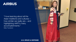 A woman in a traditional Korean dress smiles while standing in an office space. The image includes the logos for Airbus and U.S. Space & Defense, along with the quote, 