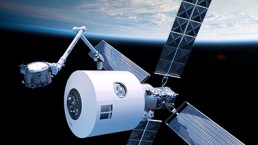 A large satellite with solar panels and a robotic arm, part of the MDA Space Joins Starlab Space as Strategic Partner initiative, floats above Earth in outer space. The Earth is partially visible in the background, with a gradient from the dark of space to the blue atmosphere.